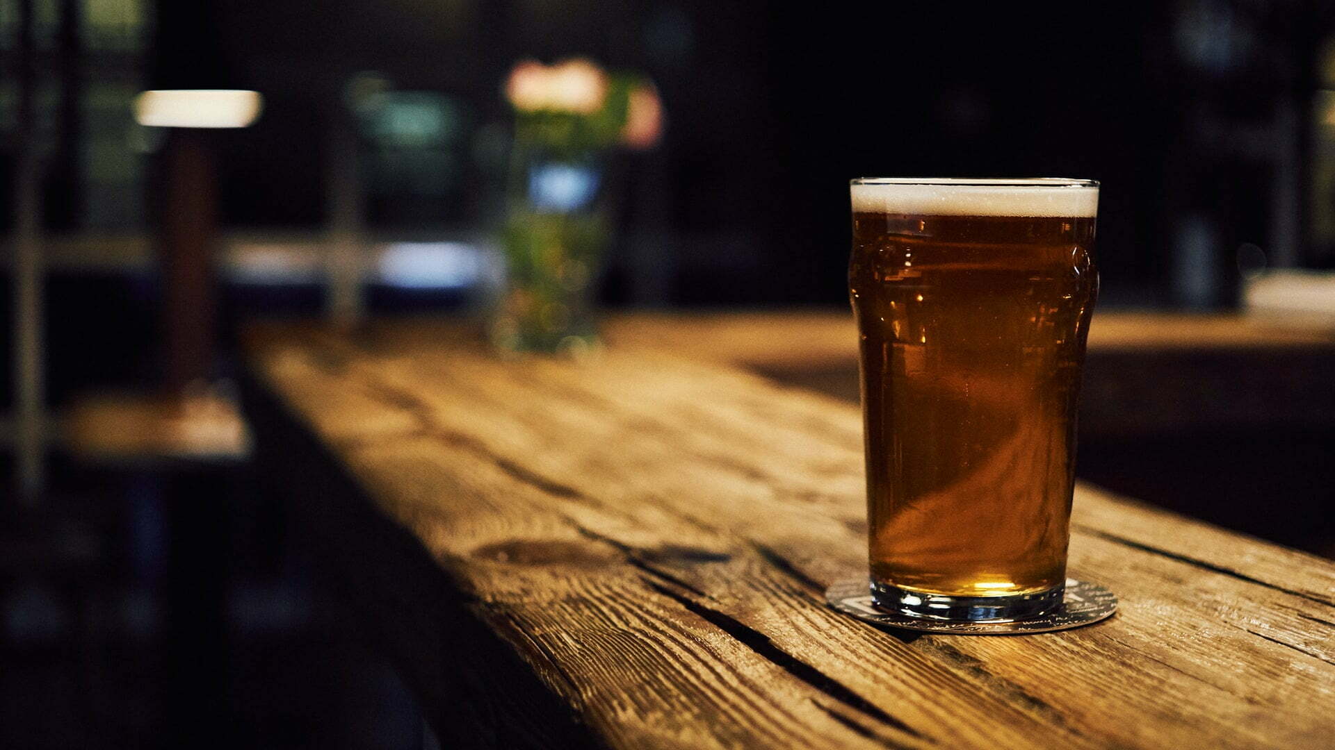 a glass of beer on a table