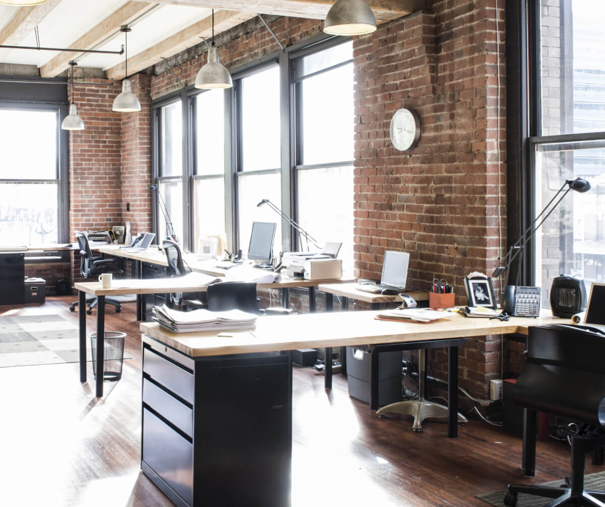 an office with a brick wall