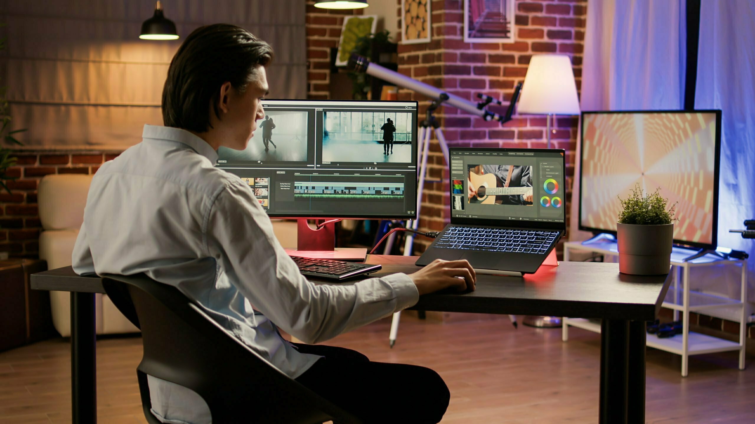 Male videographer editing footage with visual effects software